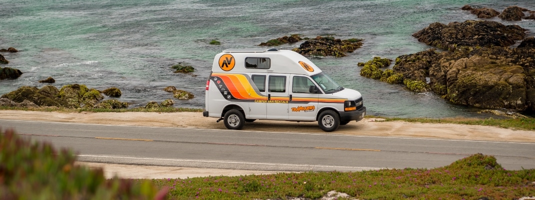 Campervan parked next to the USA West Coast