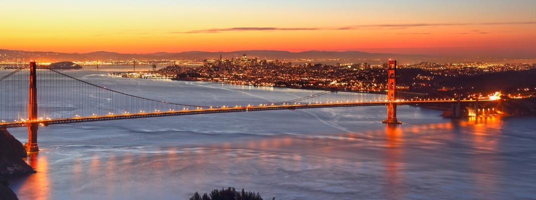 Golden Gate Bridge and skyline of San Francisco at sunrise, California, USA 