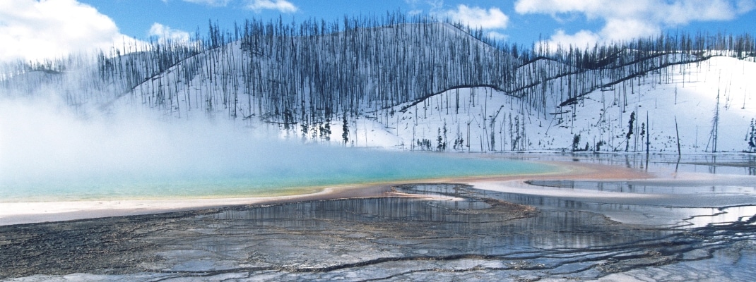 USA, Wyoming, Yellowstone National Park, Grand Prismatic Spring, mist over hot spring in winter landscape
