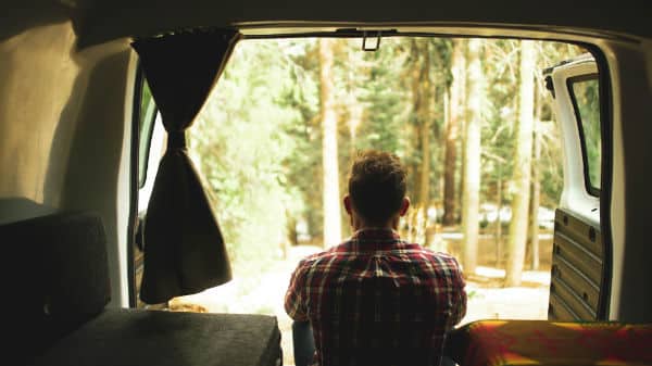 Man waking up in a campervan