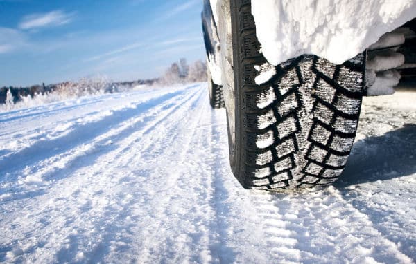 snow tires on a snow packed road