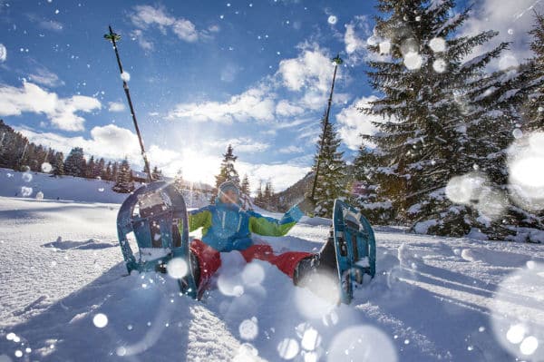 Snowshoeing and sitting in snow