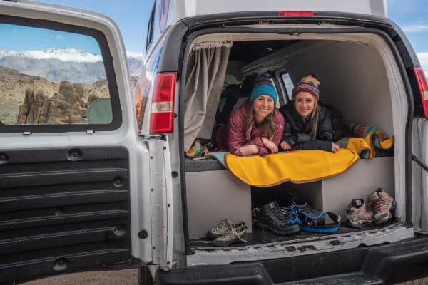 two females dressed warm in campervan