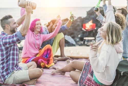 group of friends outdoors with music