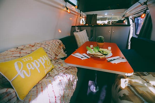 Inside a campervan with breakfast