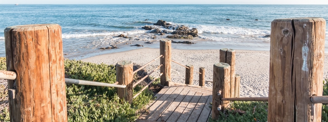 Stairs leading down to the beach and Pacific ocean at Carpinteria State Beach, California. 