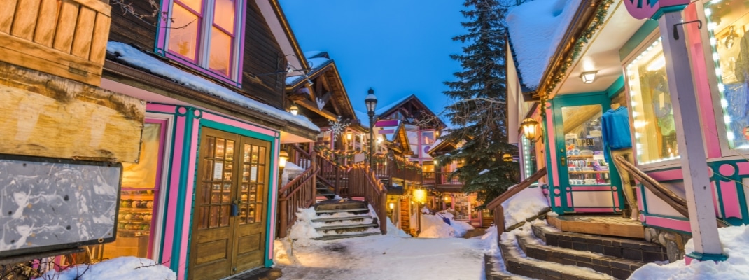 Breckenridge, Colorado, USA downtown streets at night in the winter with holiday lighting. 