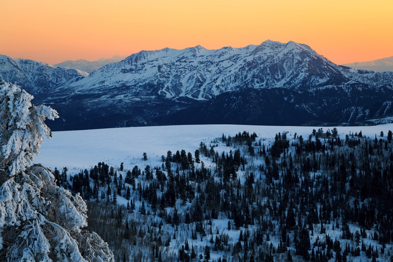 Sunset over snowy mountains at Snow Basin, Utah