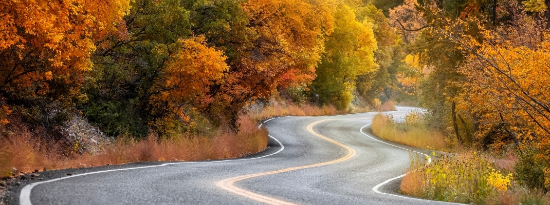 Scenic winding byway Alpine loop in Utah surrounded with brilliant fall foliage 