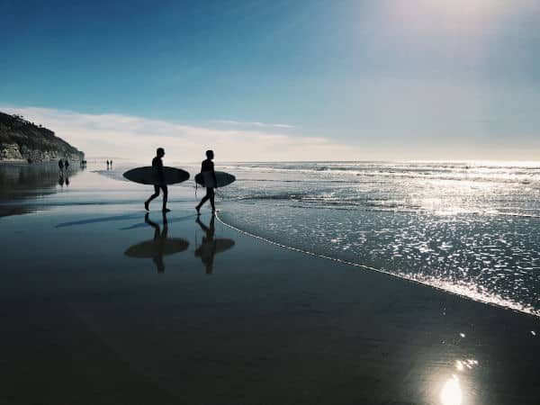 two surfers on San Diego beach
