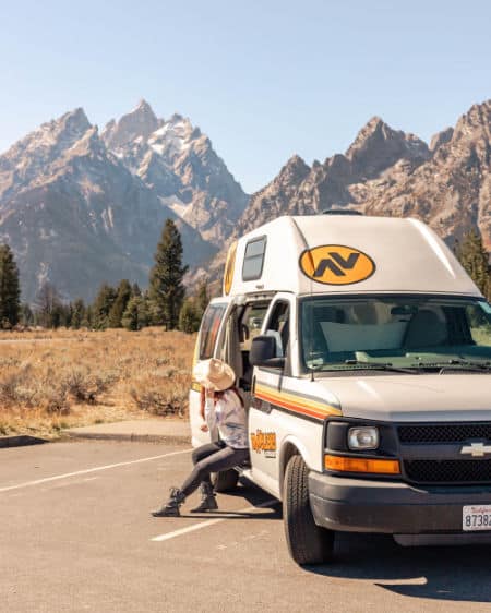 Kelly Lacy sitting in campervan