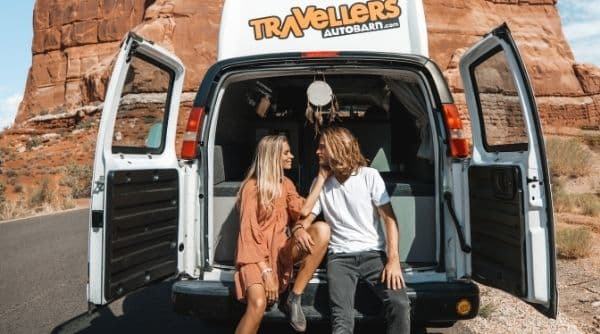 Sydney and Davis in back of Travel van