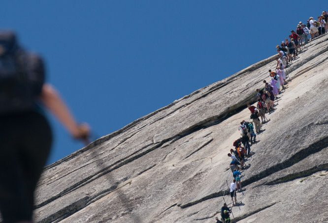 Hikers on Half Dome in Yosemite