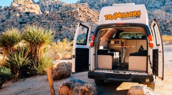 campervan with open rear doors at campsite