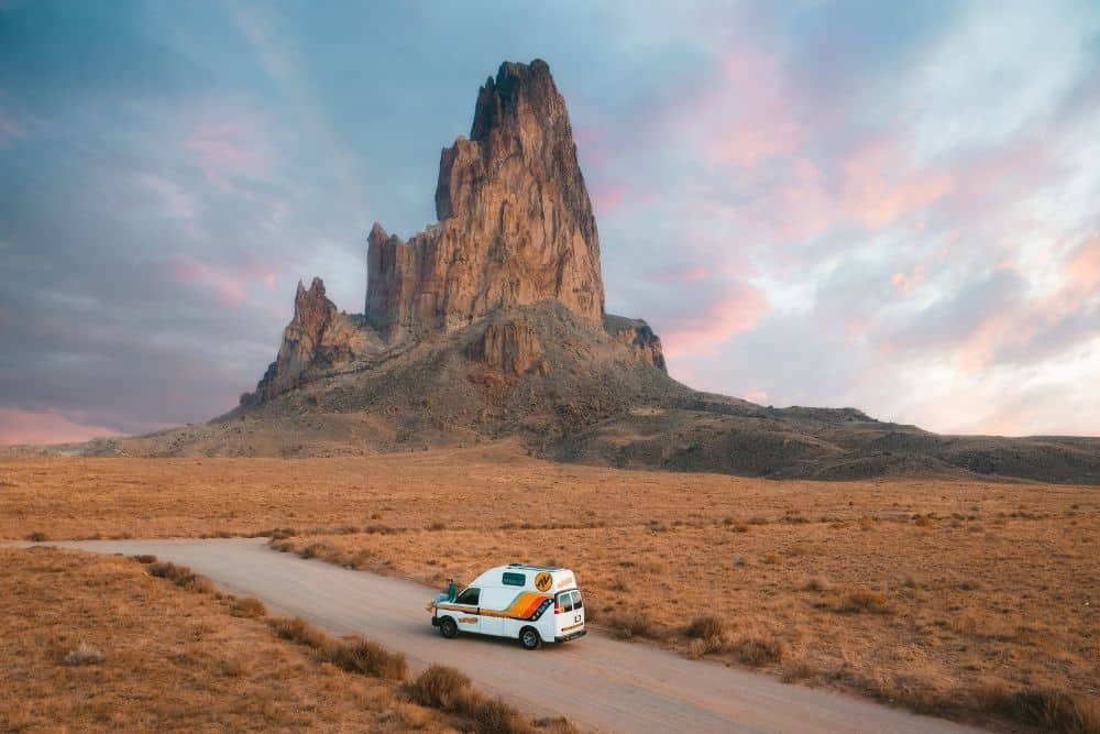 Campervan in front of rock