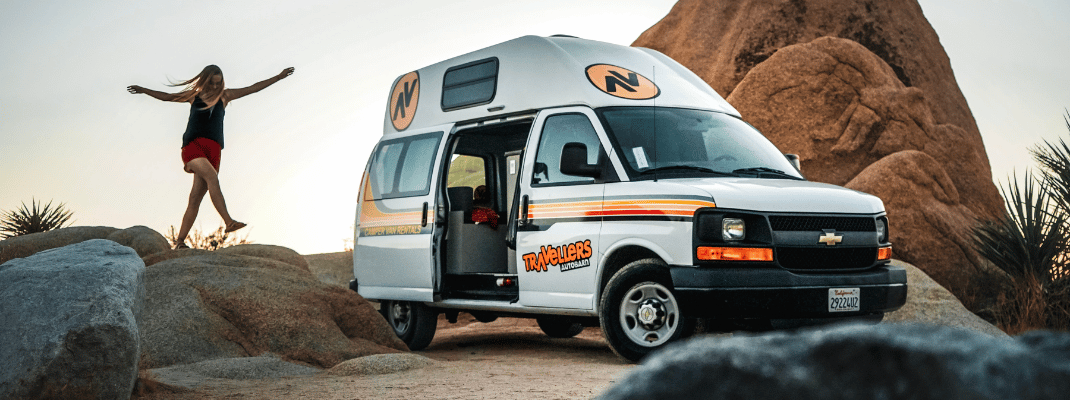 Campervan in the USA with person walking next to it