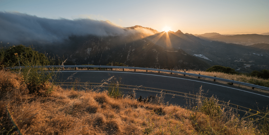 View of Curved Piuma Road and Malibu Marine Layer During Sunset in Santa Monica Mountains National Recreation Area, California