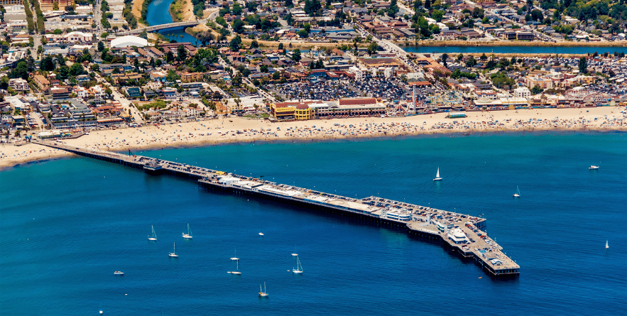 The aerial view of the city of Santa Cruz with its beach in Northern California on a sunny day.