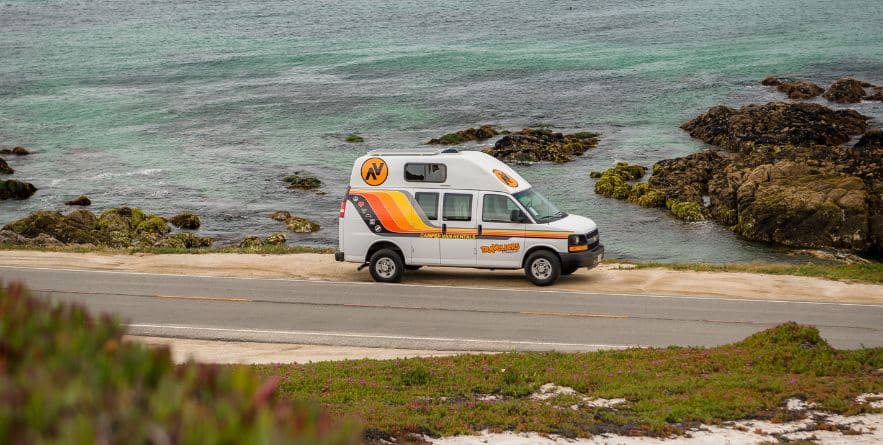 Campervan on road next to Oregon Coastline, USA