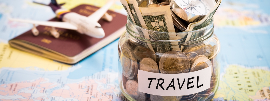 Mug with money and a plane figure