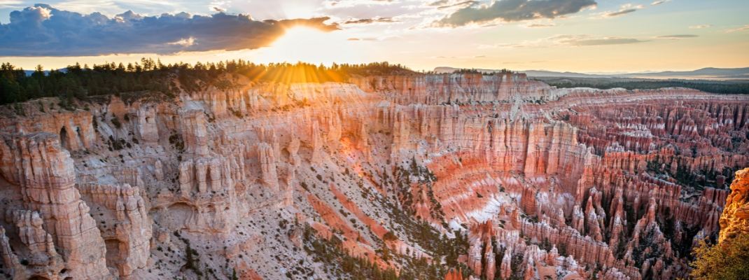 Panoramic view from Bryce Point overlook of orange colorful hoodoos