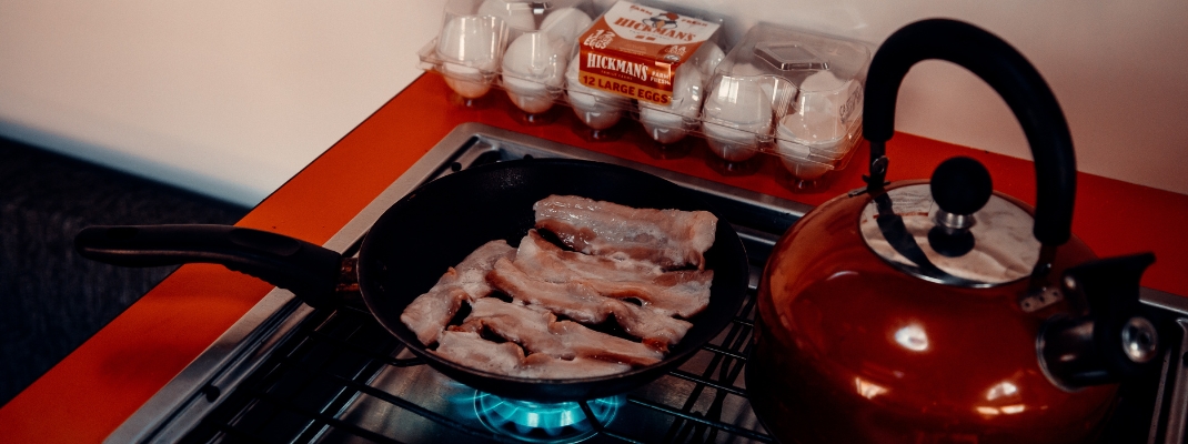 campervan stove cooking bacon