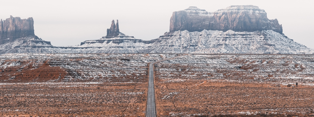 snow dusted desert and road in usa