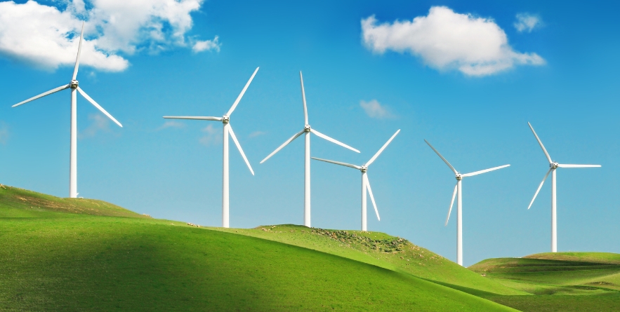 Wind turbines on green spring hills of California. Altamont Pass wind farm near Livermore.