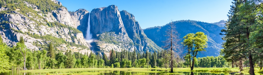Yosemite National Park – Reflection in Merced River of Yosemite waterfalls Yosemite National Park - Reflection in Merced River of Yosemite waterfalls