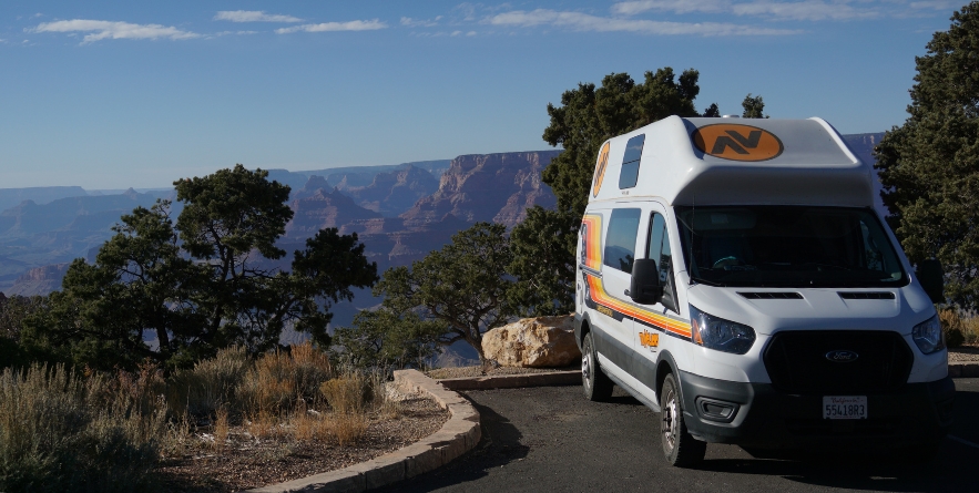 campervan parked next to grand canyon