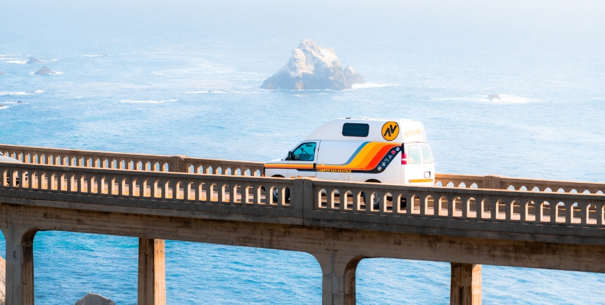 Campervan driving over Bixby Bridge, Big Sur, California