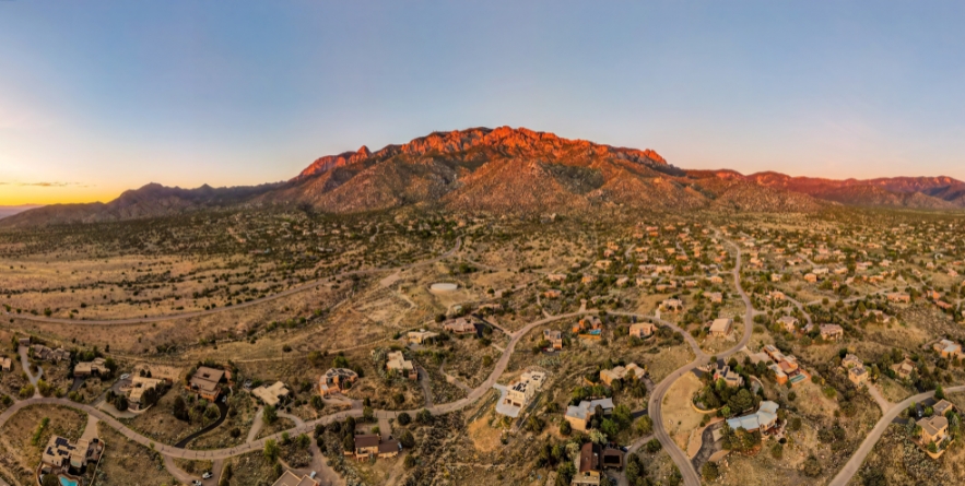 Sandia mountains in Albuquerque, New Mexico at sunset, glowing pink